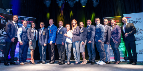 International Federation of Body Building IFBB Australia leaders and judges gathered on an event stage